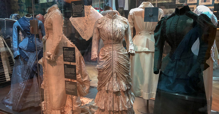 display of dresses and fashion in the Textiles gallery at The Bowes Museum